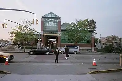 Commuters transfer from train to bus.