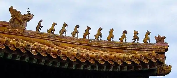 Ceramic figures decorating the Hall of Supreme Harmony at the Imperial Palace Museum. The 10 mystical beasts indicate the highest status in the empire for this building. Picture taken late September 2002 by Leonard G