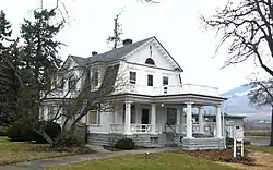 Photograph of the Hill House, a large, white house in a rural setting