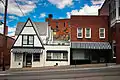 213-215 Second Street housed Cheri's Vegan Restaurant, now closed.  213 (left) was built in the 1930s in the Arts and Crafts style and long served as a diner.