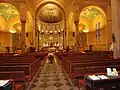 The church interior. Notice the sanctuary dome which is a copy of that of St. Clemente Bascilica Rome.