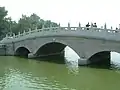 A stone bridge across the lake