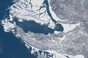 Some shelf ice remains along the shore of the peninsula as most of the ice breaks away; taken at 11:12:06 AM Central Standard Time on February 20, 2021 from the International Space Station