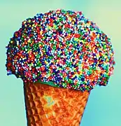 Sugar cone dipped in rainbow sprinkles