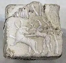 Fighting scene between a beast and a man with horns, hooves and a tail, who has been compared to the Mesopotamian bull-man Enkidu. Indus Valley Civilisation seal.