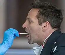 Demonstration of a throat swab for COVID-19 testing