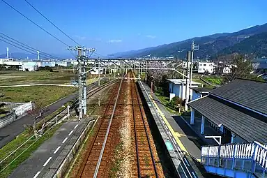 A view of the platforms of Iyo-Sangawa Station in 2010. A siding can be seen branching off track 2 on the right.