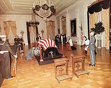 The remains of John F. Kennedy lying in repose in the East Room of the White House on November 23, 1963.