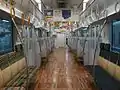 The interior of KuHa 305-3 (car 1 of set W3) with wooden flooring, February 2015