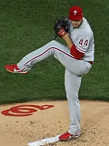 A baseball player in a gray uniform