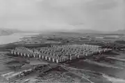 Rows of the same concrete apartments surrounded by rural fields