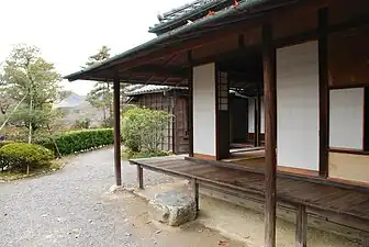 After rain; the eaves have kept the en mostly dry, and the en has kept the foundations of the house quite dry.