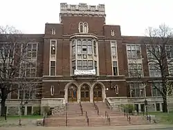 Four-storey red brock building constructed in Victoria Era architecture