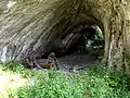 Statues of Neanderthal in the Dark Cave