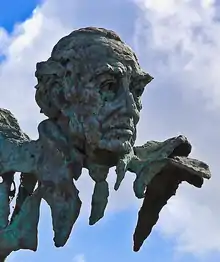 Jesús Delgado Valhondo on the Monumento a los Tres Poetas in Badajoz, Spain. Sculpture by Luis Martínez Giraldo