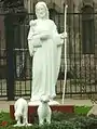 A sculpture of Jesus in front of the cathedral