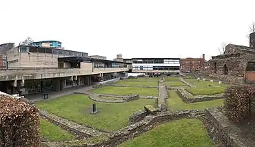 Vaughan College, the university's former adult education college, is Grade II listed and faces the Jewry Wall Roman ruins