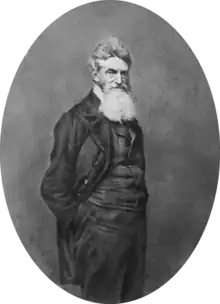 Photograph of John Brown, wearing a suit and a large bushy beard