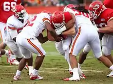 Photograph of Roberts running the football apparently during a practice with the Kansas City Chiefs