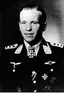 Man in uniform, with order around his neck