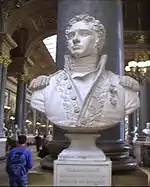 Bust of a curly-haired man wearing a uniform with epaulettes