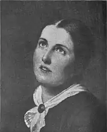 A young white woman, eyes cast upward, hair parted center and dressed back to the nape, wearing a white kerchief fastened with a pin at her throat