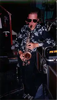 Trosper playing the saxophone in an undated photo.