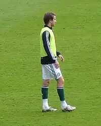 A man wearing a training kit.