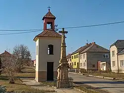 Belfry and cross in the centre of Olbramice