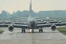 The front of several gray aircraft are centered in the image.