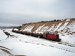 Locomotive TU7-1231 with freight train