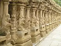 precinct of a temple with sculptures on either side