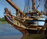 The bow of the replica Kalmar Nyckel including a two-tailed lion figurehead, one tail symbolizing the old ship and one symbolizing the new ship.