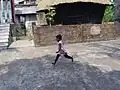 A little girl playing at the courtyard