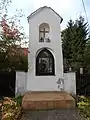 Classicist Warmian wayside shrine nearby the church