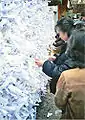 Tying omikuji at Kasuga Shrine