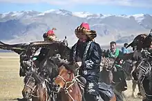 Mounted hunters in traditional dress