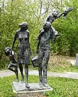 1978 Bronze statue of family with picnic basket. Situated at the entrance to the Amsterdamse Waterleidingduinen park in Vogelenzang, Netherlands