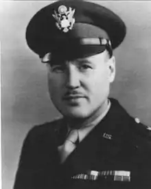 Head and shoulders of a man in uniform with a peaked cap