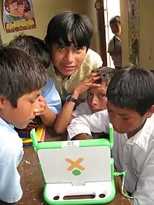 Image 26Peruvian school children with an OLPC XO-1 laptop (from Demographics of Peru)