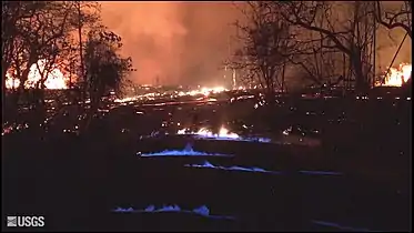 Blue flames from burning methane gas in Leilani Estates, on 22 May 2018, 11:30 p.m. HST.