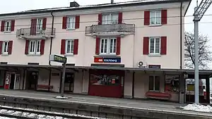 Three-story building with gabled roof