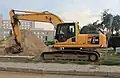 The bucket excavator Komatsu PC210-LC.