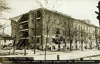 A tobacco warehouse with its sides damaged,