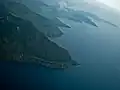 Aerial view of the southern shore with Sibandang Island visible in the background