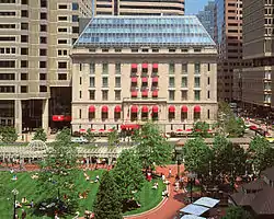 The Langham Hotel is situated along the northeastern edge of the square. Norman B. Leventhal park is also visible in the foreground.