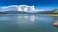 Storm clouds build near Crater Lake in the distance, and reflect in the waters of Lost Creek Lake, Oregon.