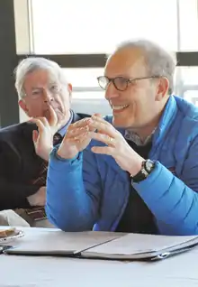 Len Schlesinger co-leading a Community Commerce roundtable with John McArthur in a renovated Blackstone Valley mill.