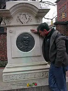 Levi Asher at grave of Edgar Allan Poe in Baltimore, Maryland