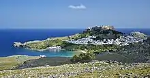 General view of the village of Lindos, with the acropolis and beaches, island of Rhodes, Greece.